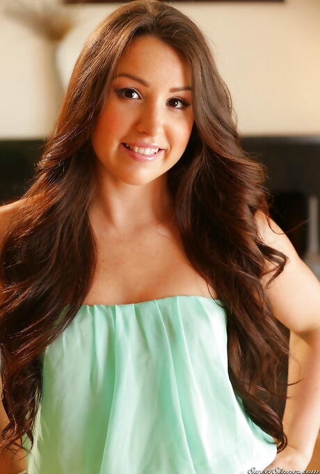 Very attractive latin brunette Lola Foxx in undies revealing small tits and spreading her legs 